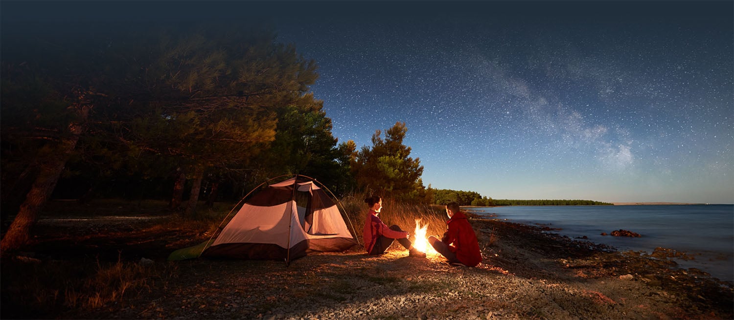 camping under the stars at the lake